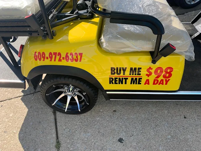Yellow golf cart, side view